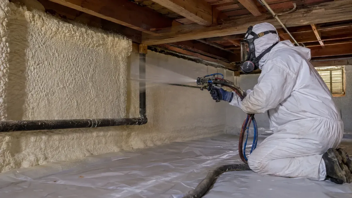Professional Sammamish insulation contractor applying spray foam to improve air sealing and building energy efficiency.