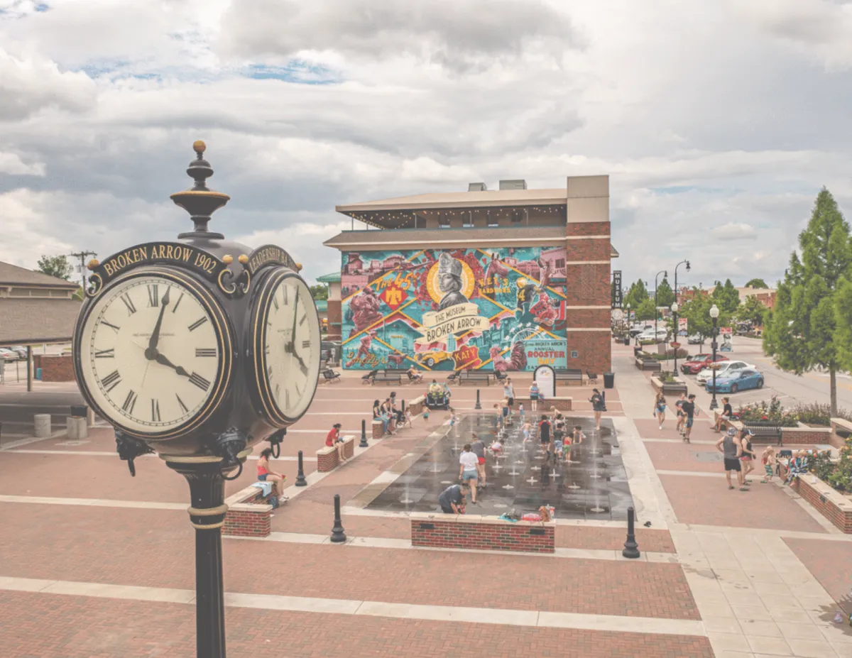 Clock tower and colorful murals in the Rose District in Broken Arrow.
