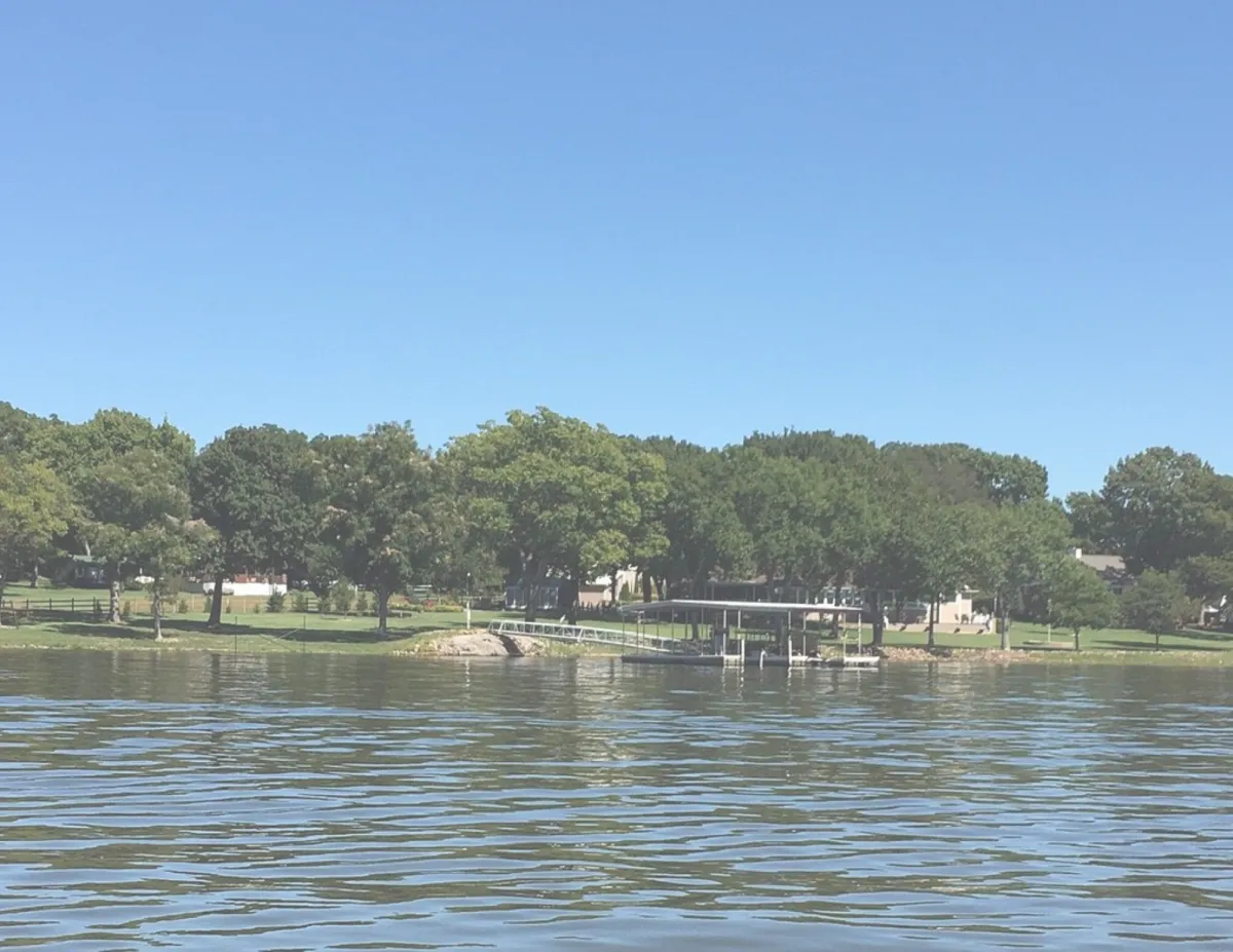 Children playing at the colorful Bixby splash pad and playground during summer.