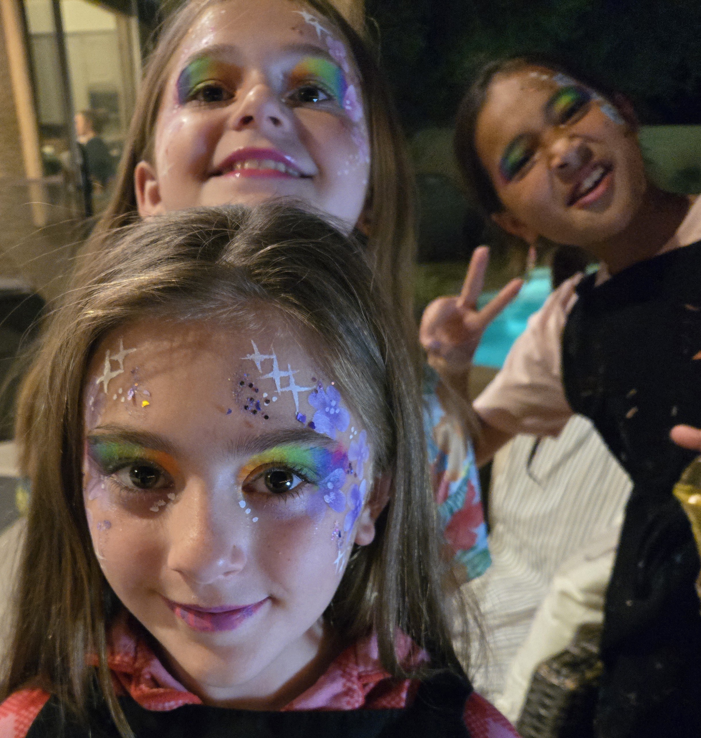 Kids having fun and showing off their face paintings