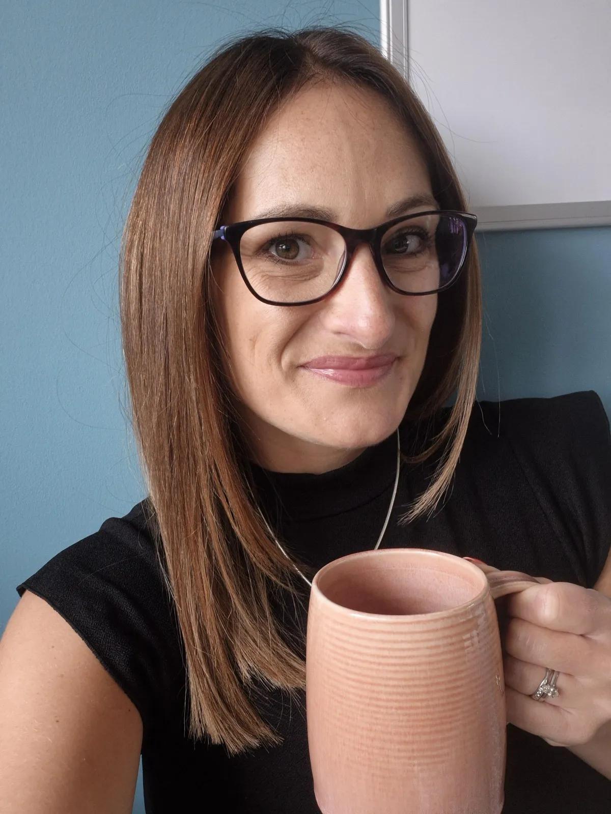 Jade Zammit Sleep Coaching holding coffee