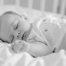 baby sleeping in cot