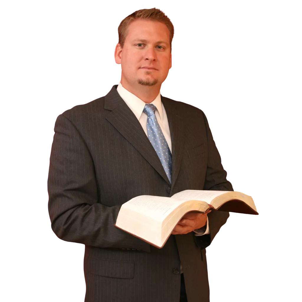 Pastor teaching a small group in a warm, confident setting