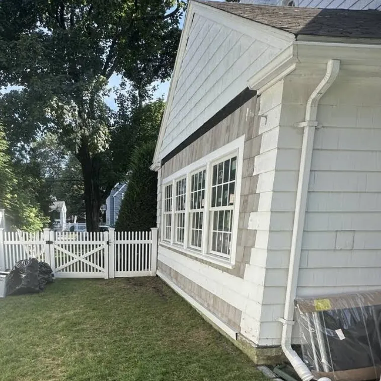 Historic home siding restoration maintaining original character