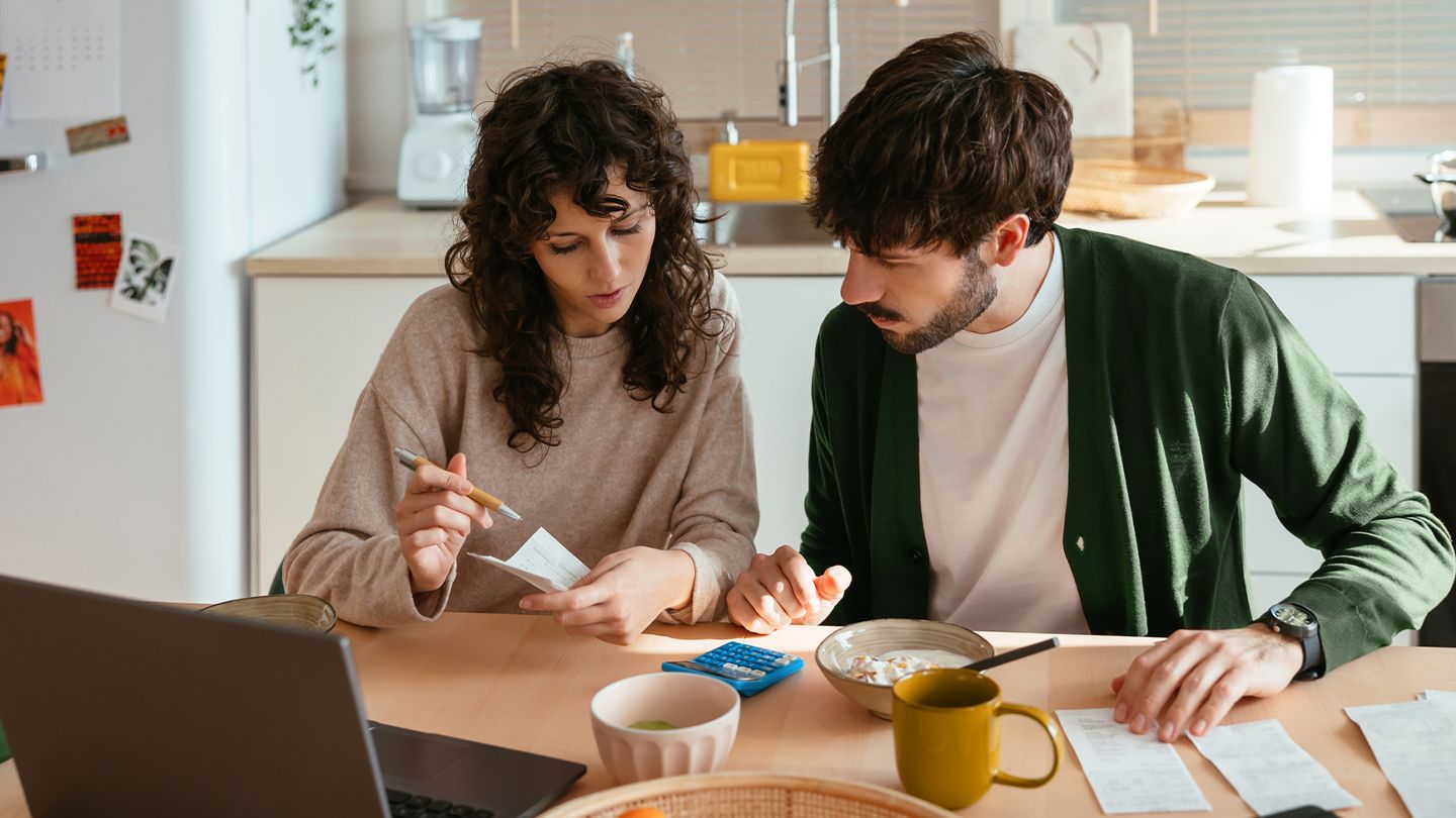couple reviewing documents at home