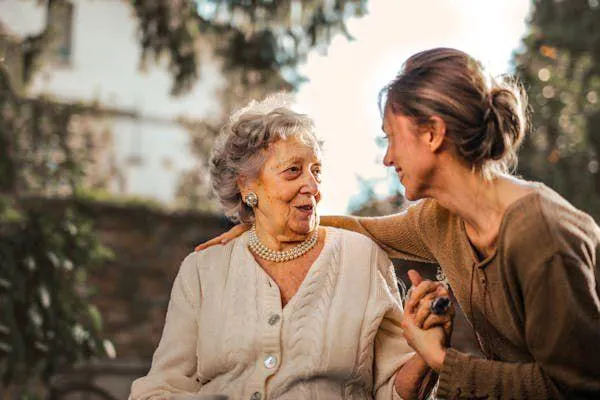 Young caregiver with elderly woman