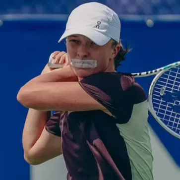 Iga Swiatek the tennis player wearing mouth tape while training