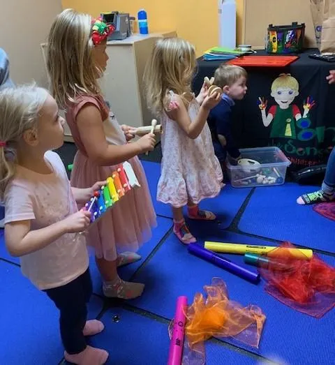 Girl follows directions during arts and crafts time.