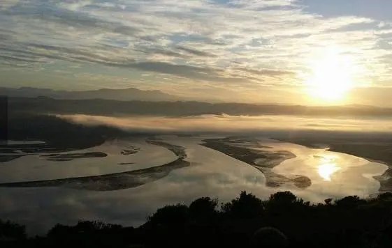 a room with a bar and stools
