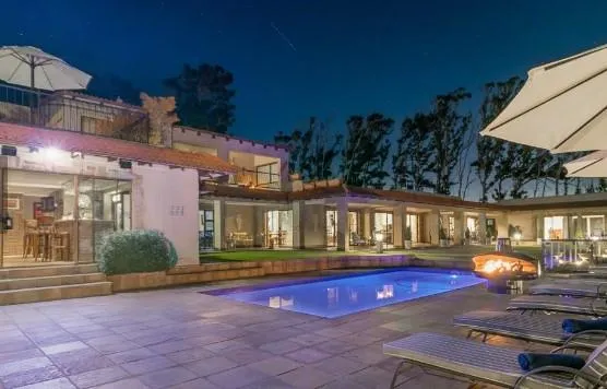 black and brown wooden table near blue padded chair
