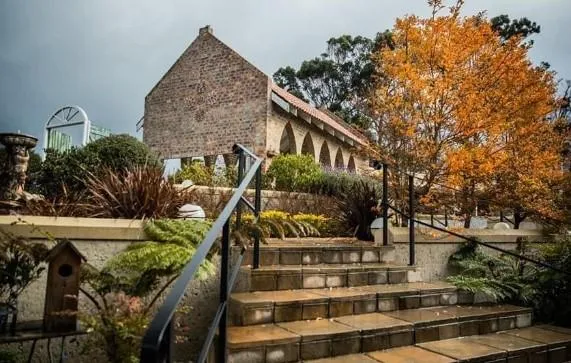 black and brown wooden table near blue padded chair