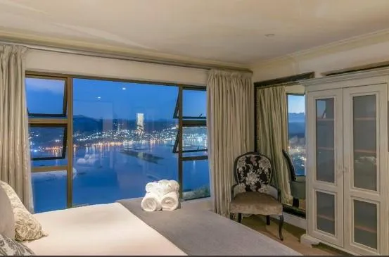 black and brown wooden table near blue padded chair