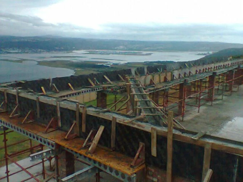 a room with a bar and stools