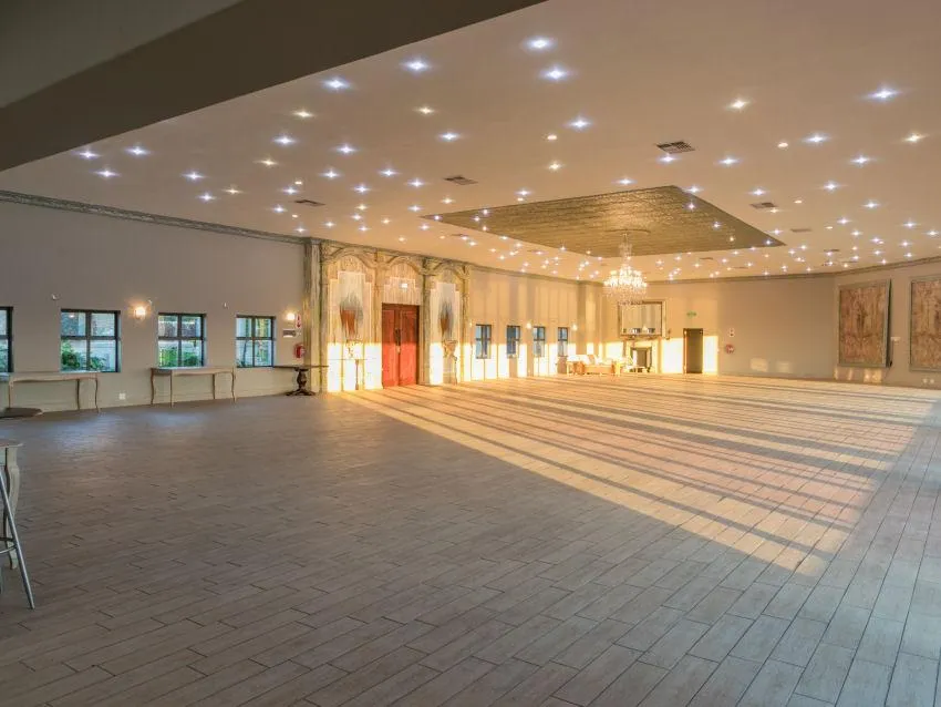 black and brown wooden table near blue padded chair