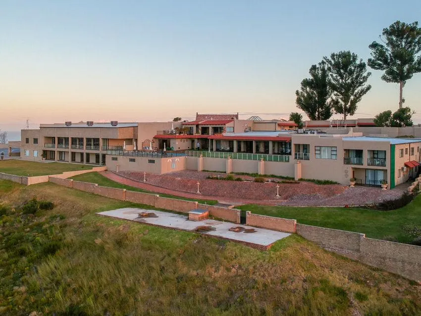 black and brown wooden table near blue padded chair