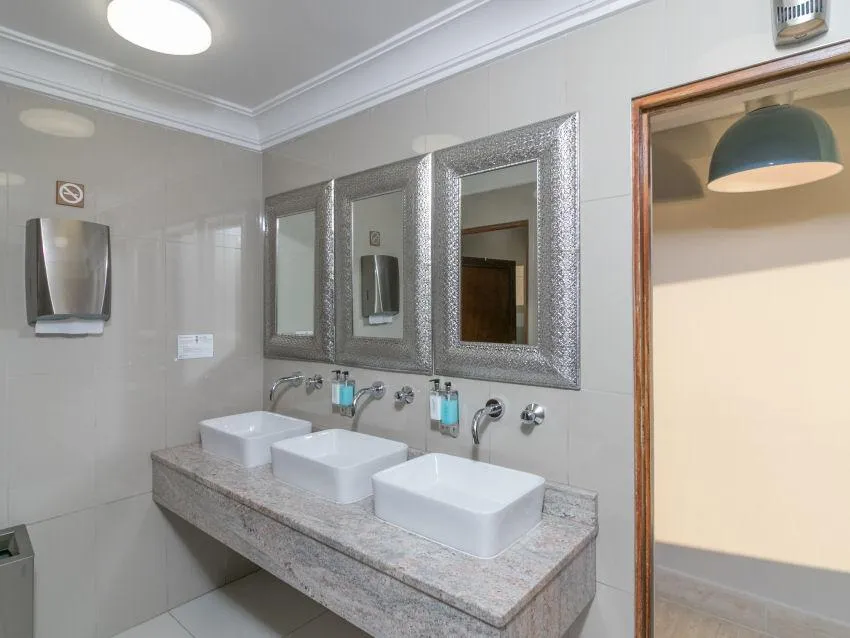 a room with a bar and stools