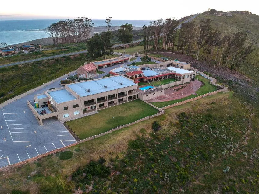 a room with a bar and stools