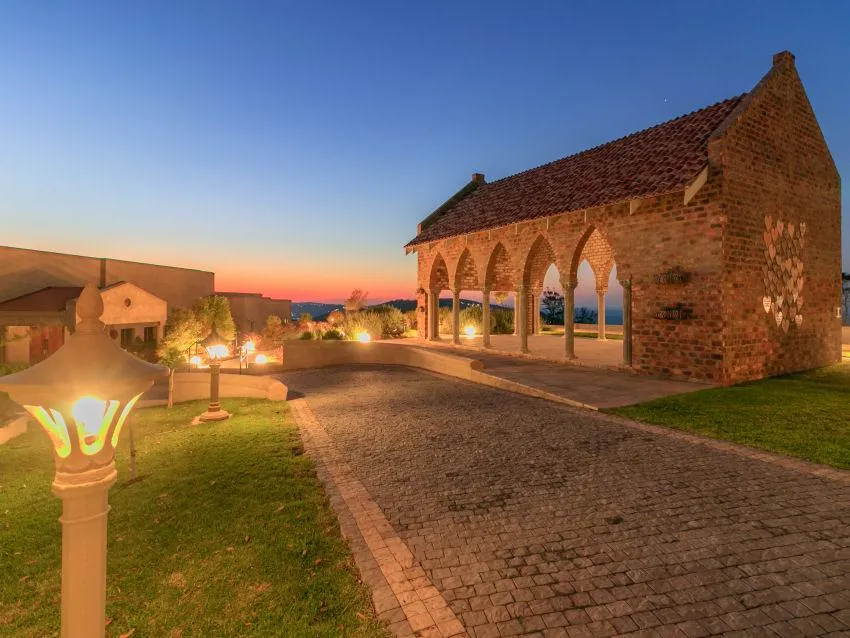 black and brown wooden table near blue padded chair