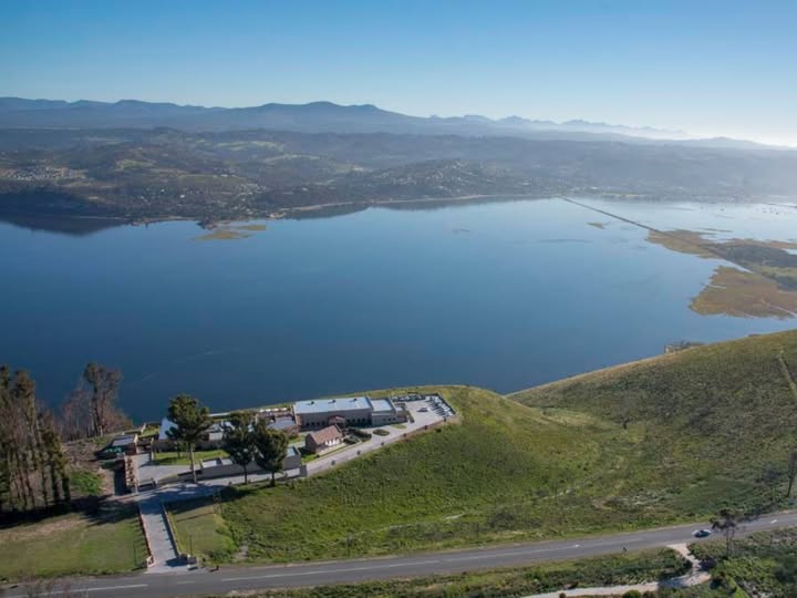 a room with a bar and stools
