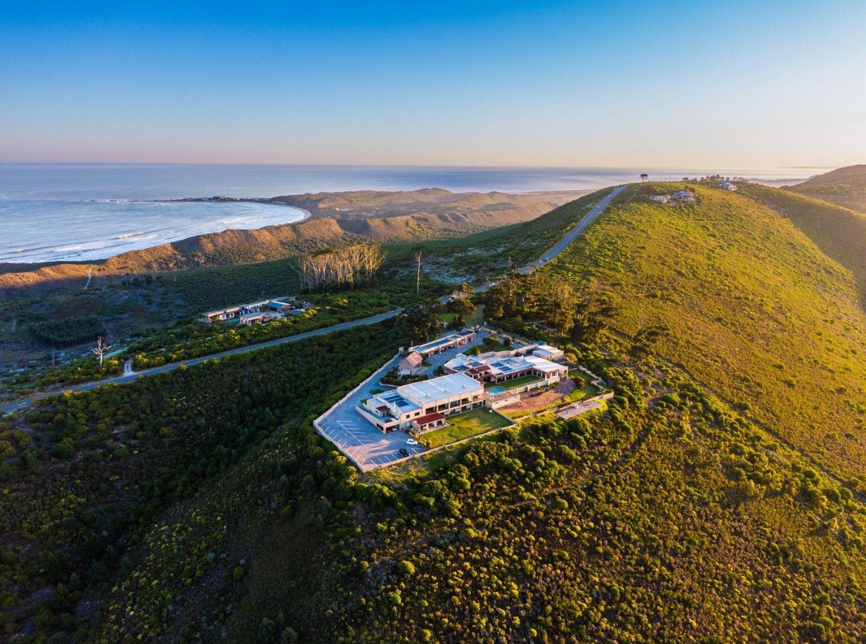 a room with a bar and stools