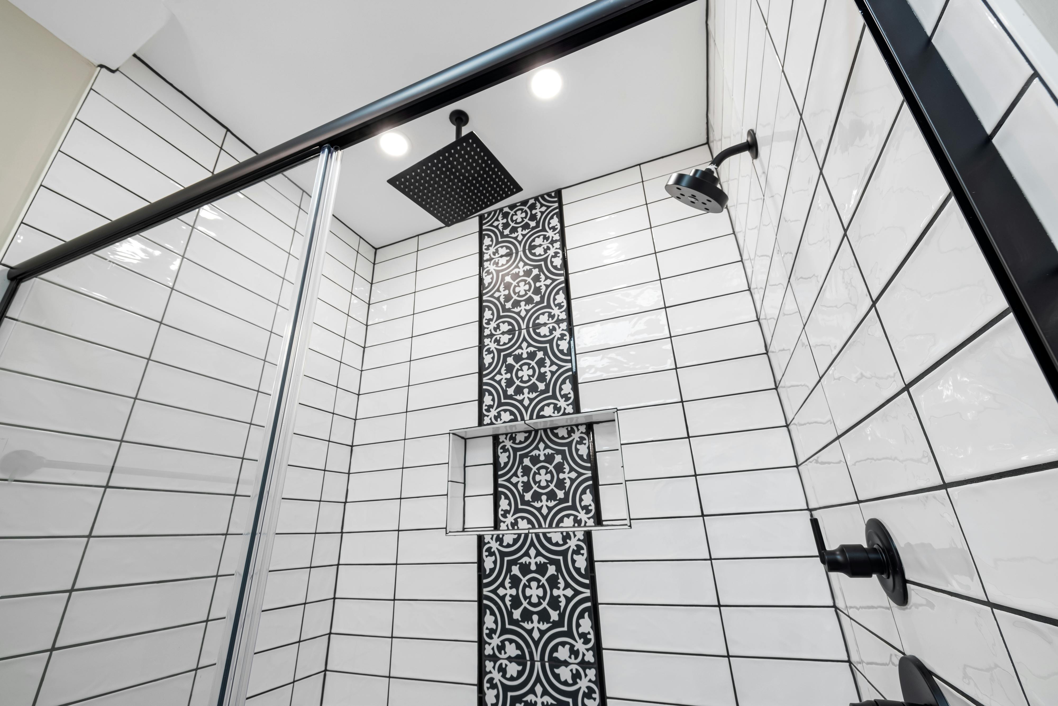 white ceiling shower with wall shower in same enclosure