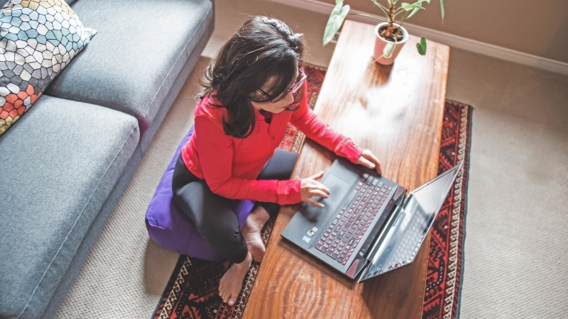 Tracy Seider working at a low floor desk 