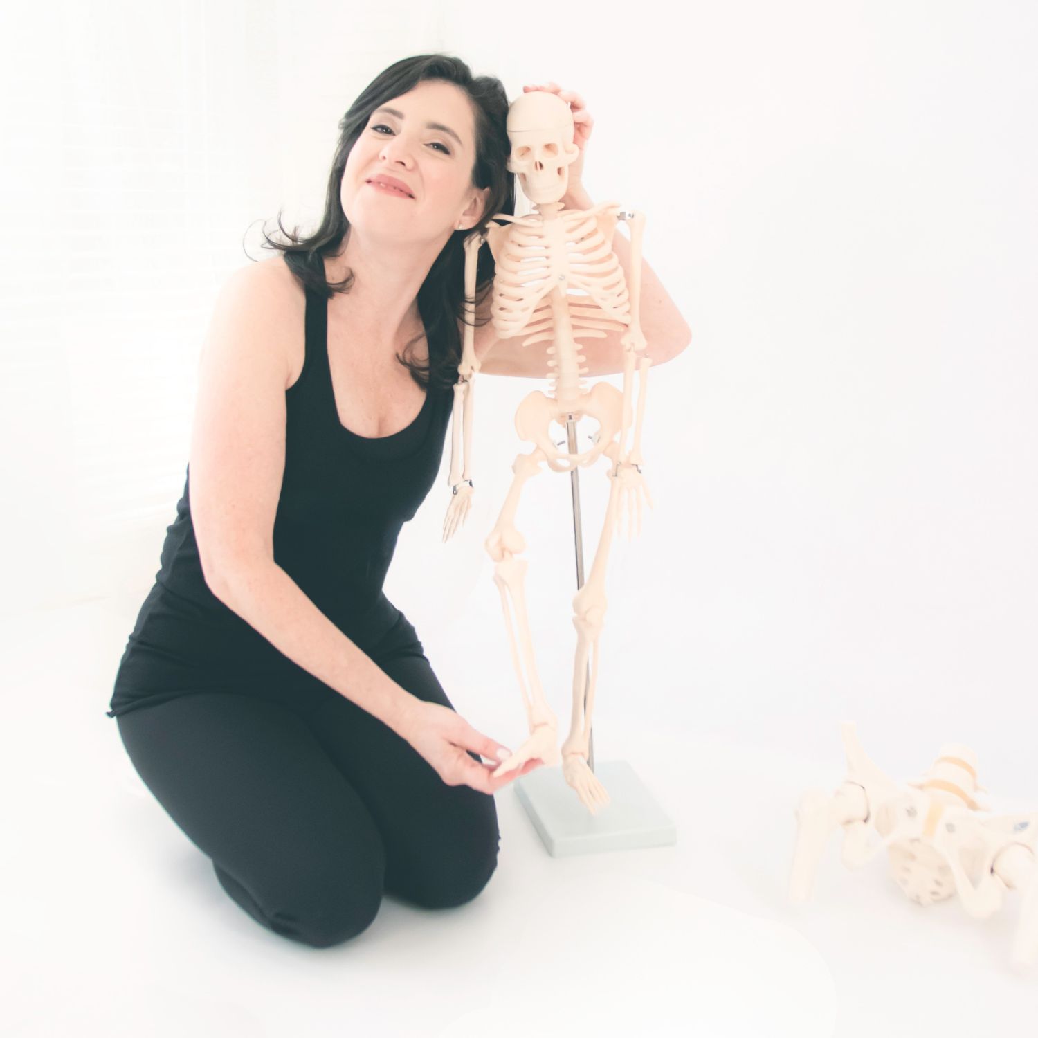 Tracy Seider with an anatomical skeleton model
