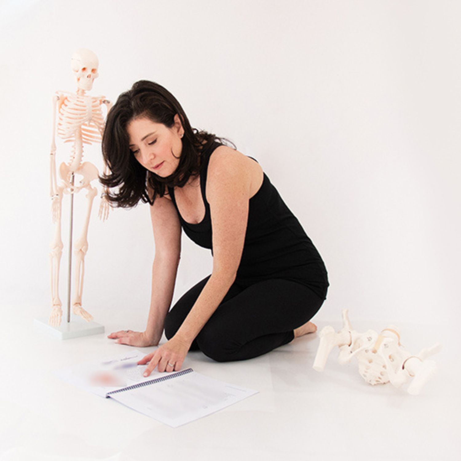 Tracy Seider assessing posture and whole-body alignment using anatomical skeleton models