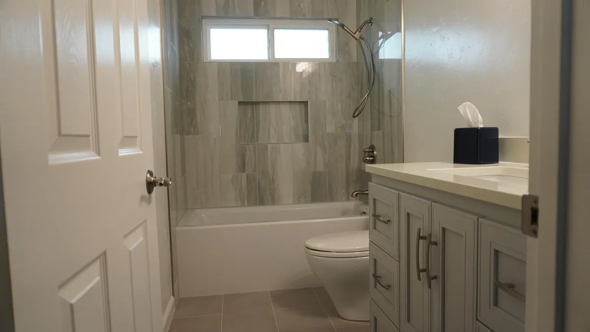 Bathroom remodel with Grey Carrera Marble, white tube, grey vanity in Petaluma, CA