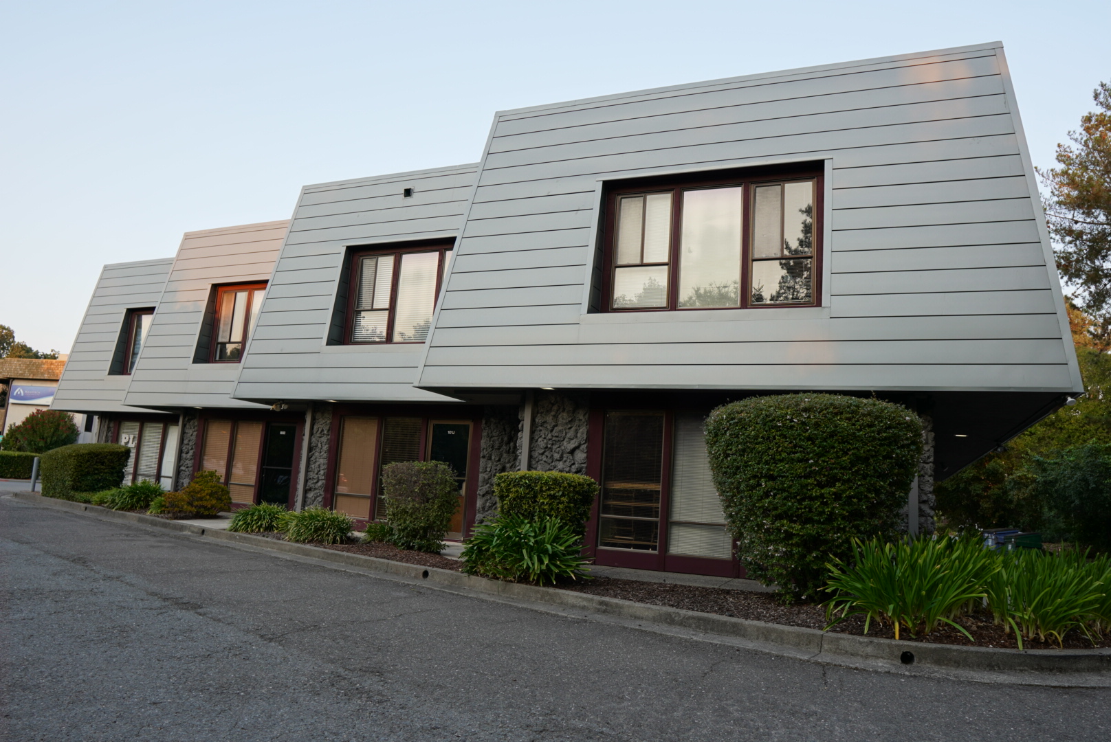   Commercial building recladding in Novato, California, featuring Western States metal siding replacing the original cedar shingle exterior.  