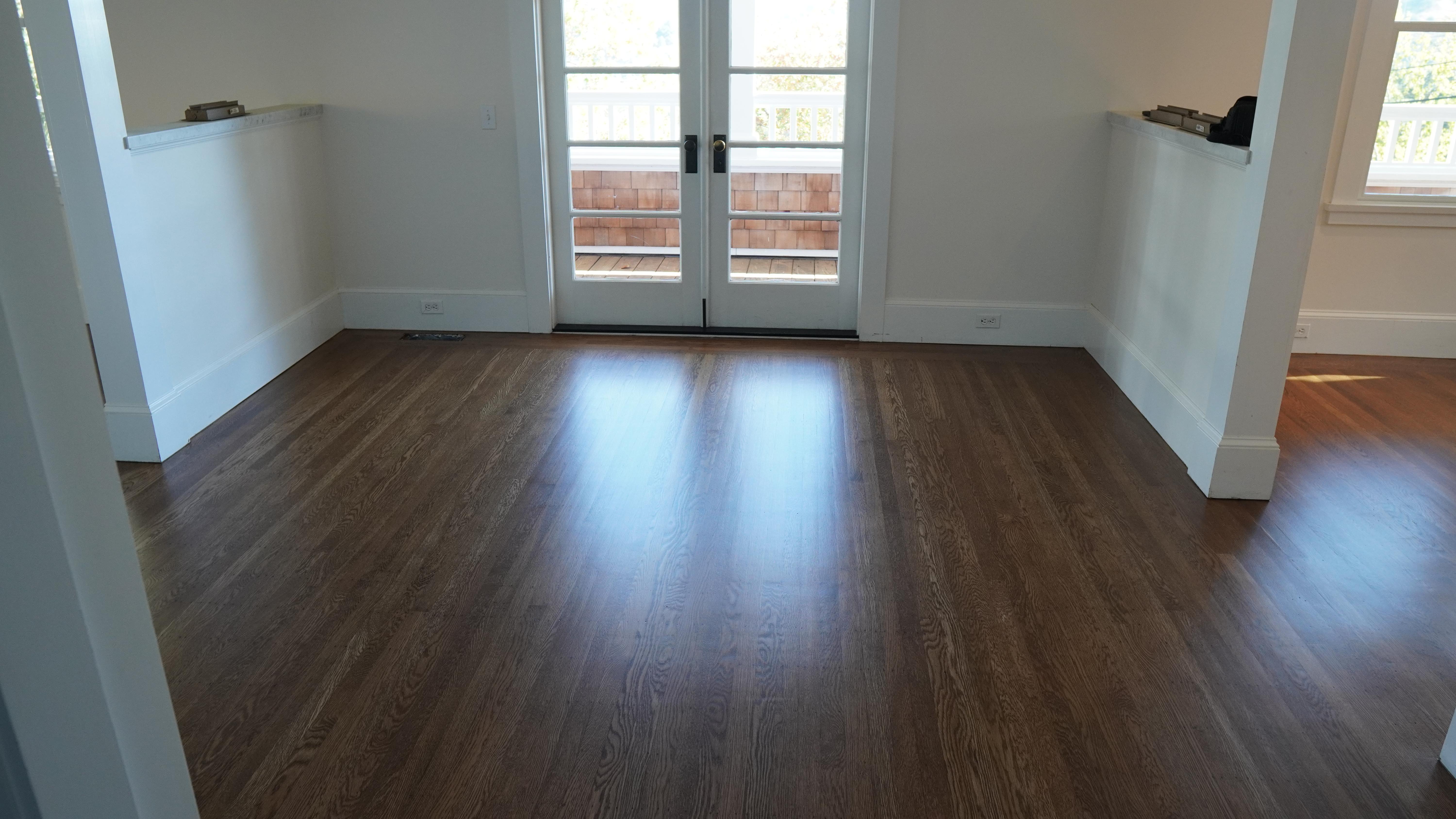 New hardwood floor installation with a dark walnut finish In Novato, CA