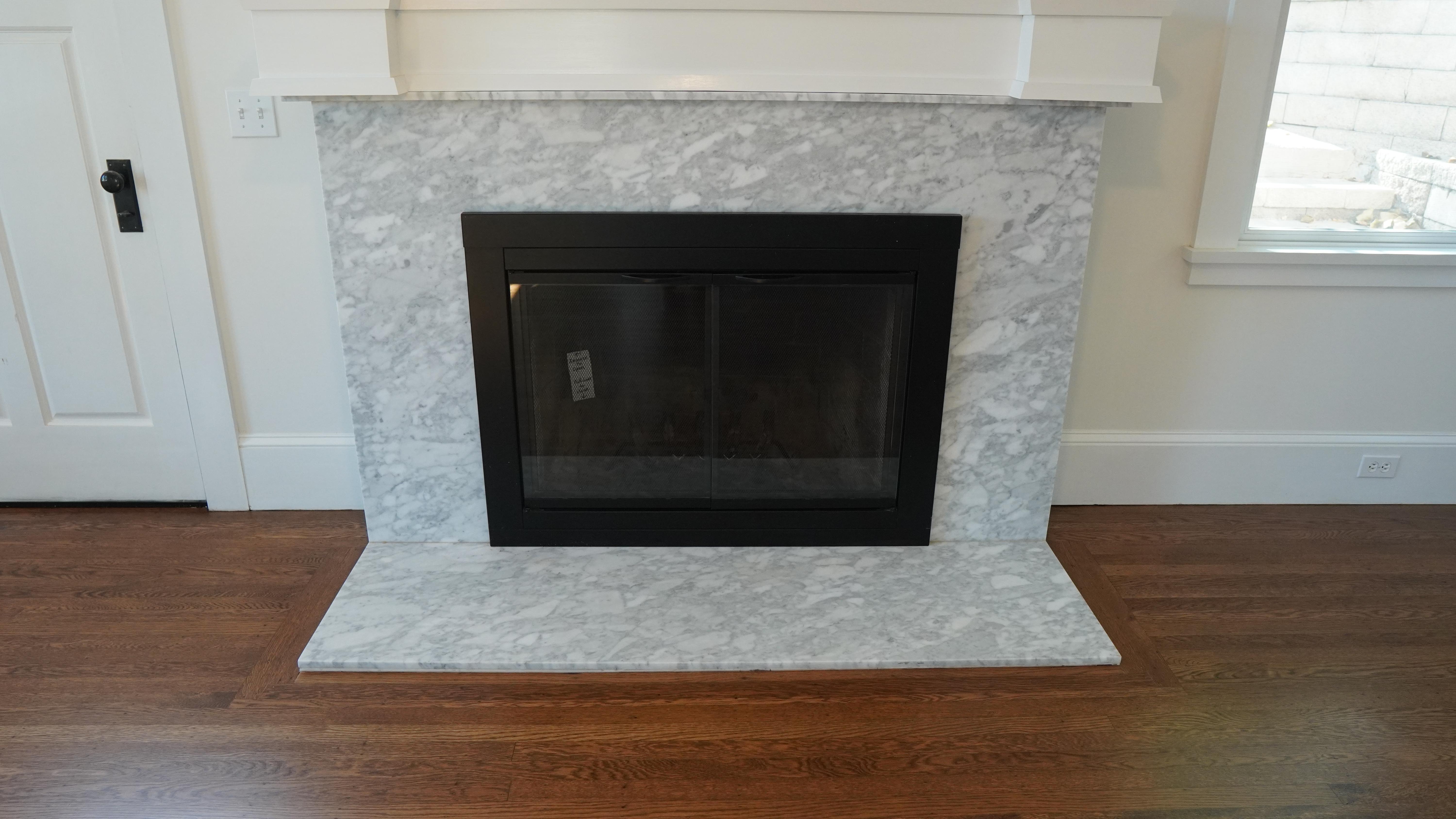 Decorated chimney with white Carrera Marble in San Francisco, CA.