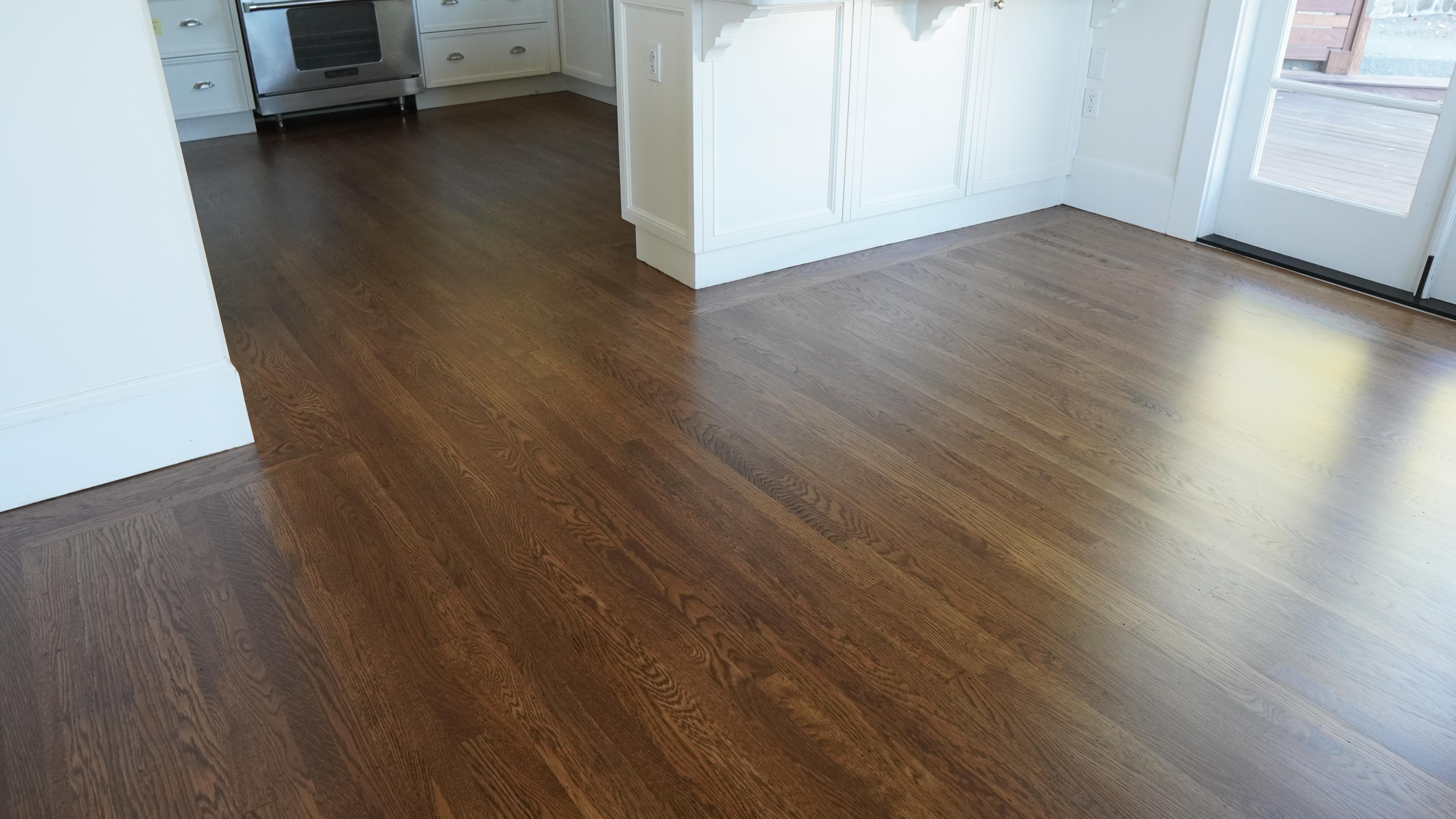 Hardwood floor installation with a dark walnut finish in Novato, CA.