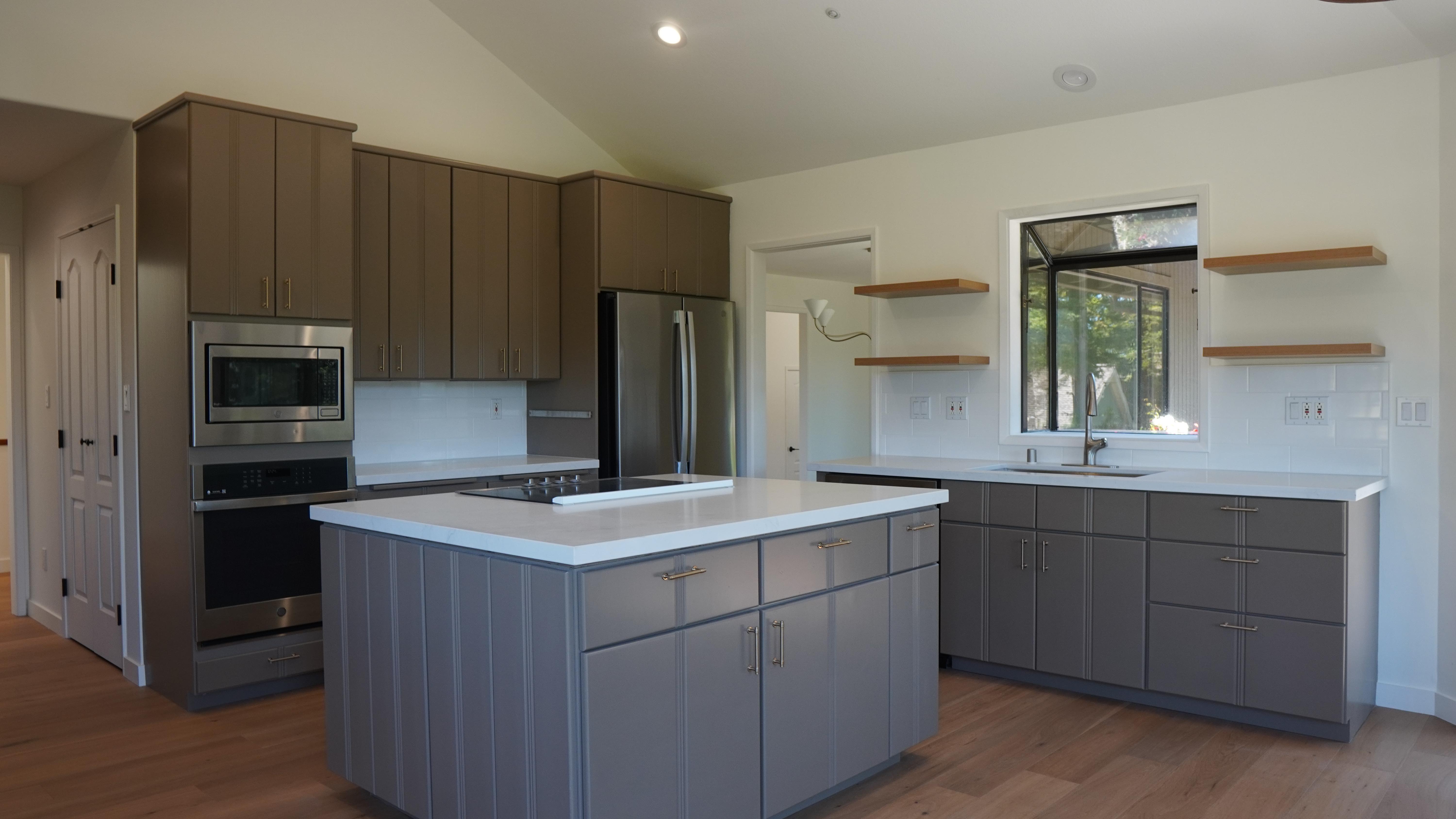 kitchen remodel on Oak View Ct in Novato, CA, featuring new cabinet, new quartz countertops, European white oak floors and floating shelve.