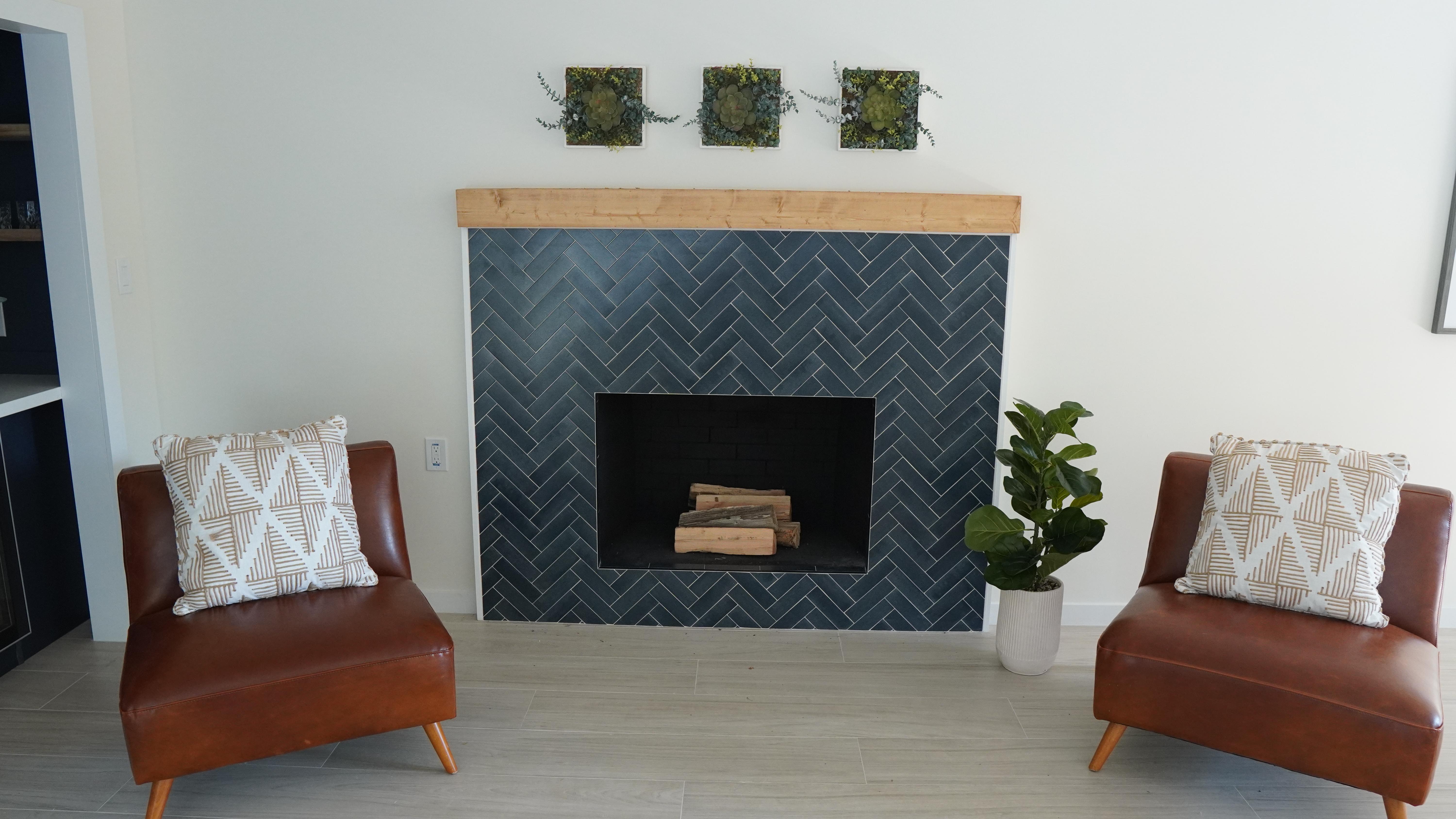 Chimney decorated with blue tile and woo mantel in Half Moon Bay, CA.
