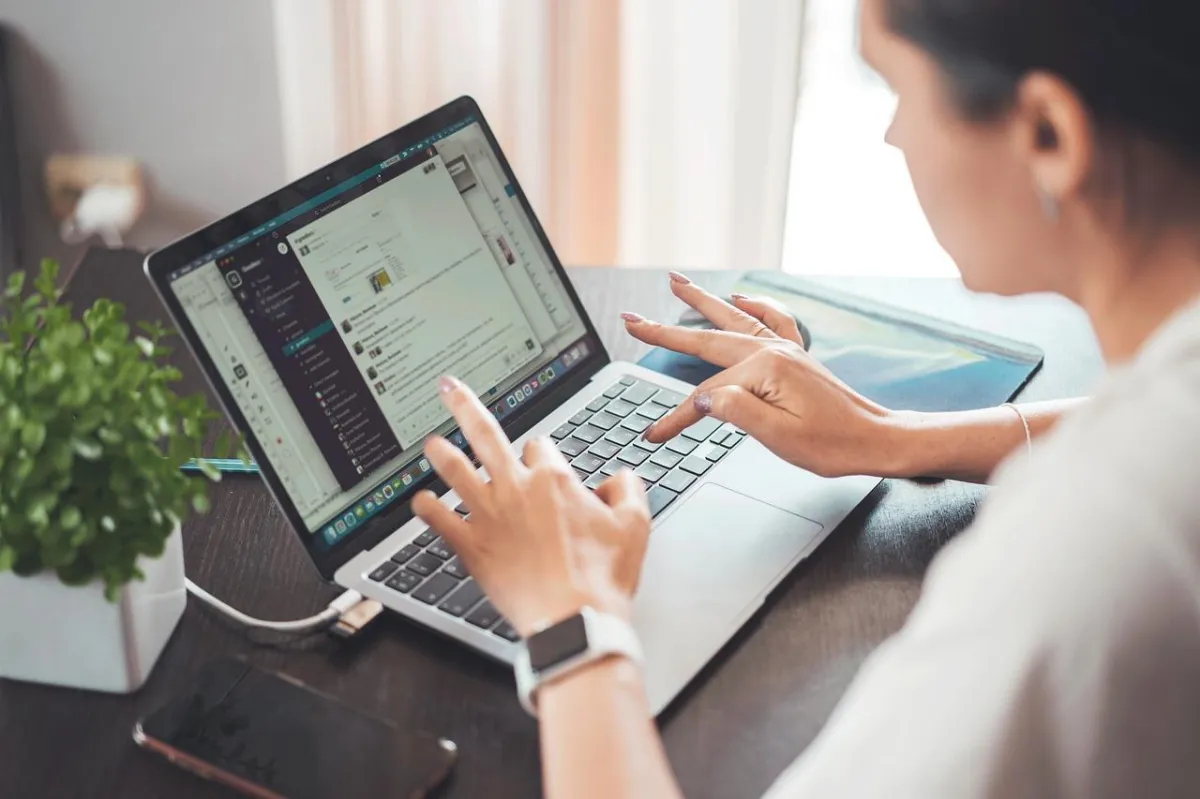 Female business owner typing on her computer