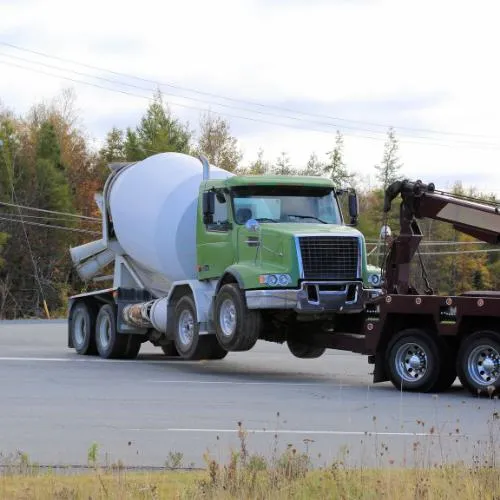 Concrete truck being towed