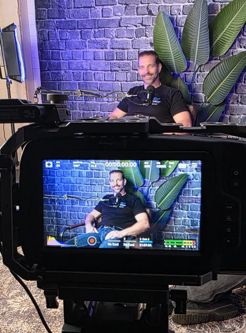 An image from behind a Blackmagic camera for recording a video for marketing purposes.