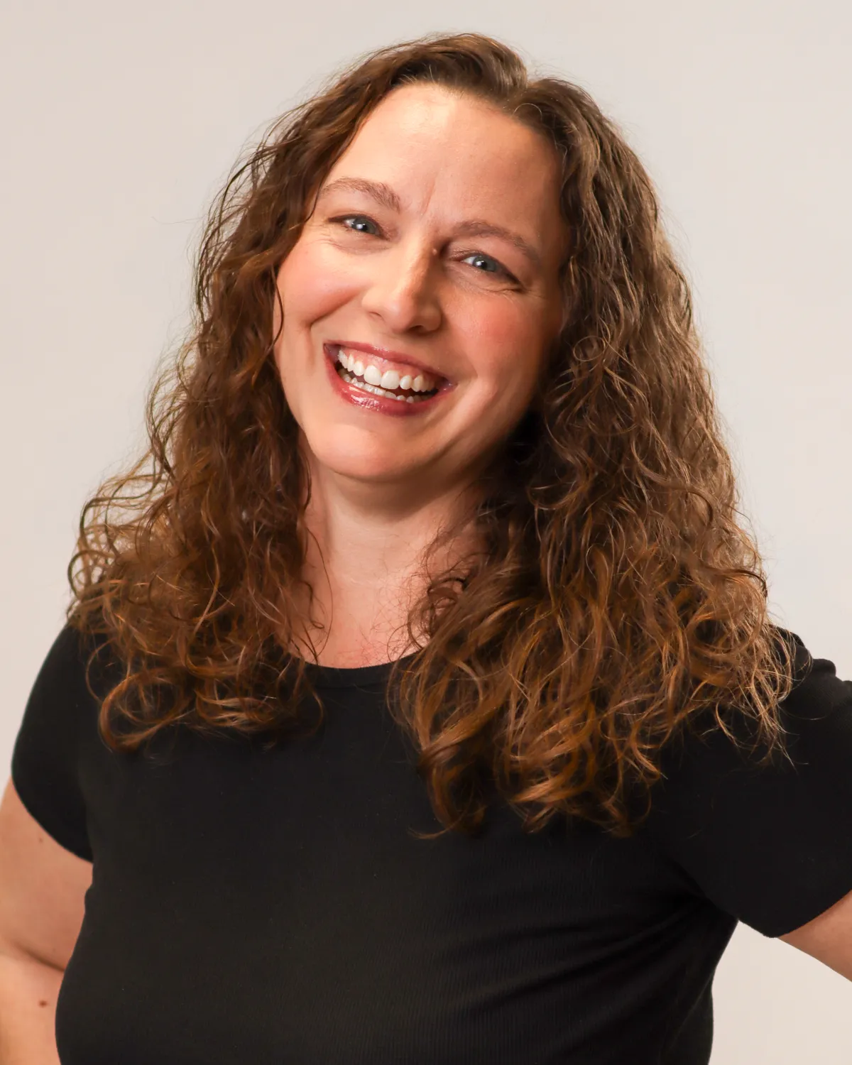A headshot photo of a female done at the A Squared Studio