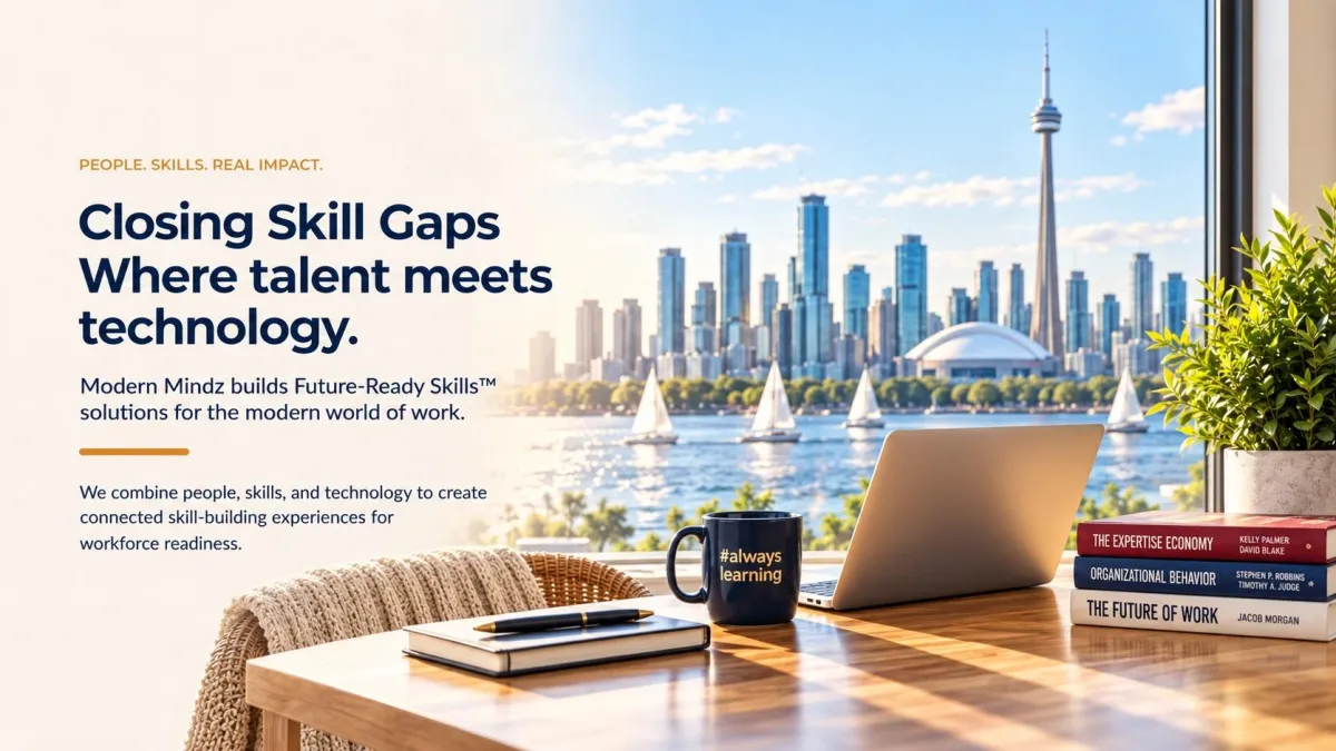 Laptop, books and an #alwayslearning mug overlooking the Toronto skyline.