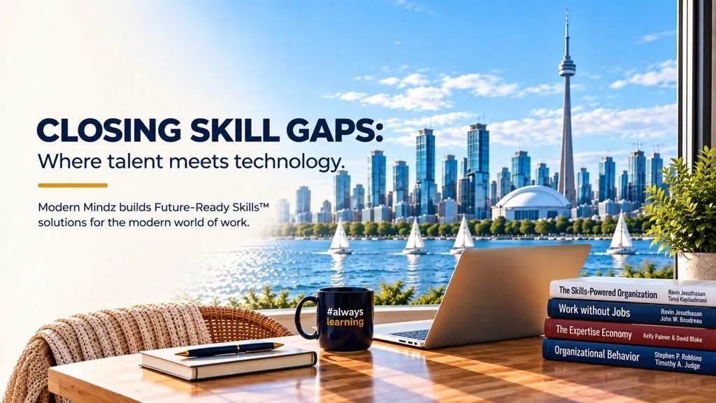 Laptop, books and an #alwayslearning mug overlooking the Toronto skyline.