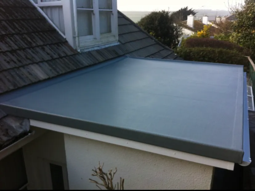 Roofing service in Ramsgate replacing roof tiles on a house