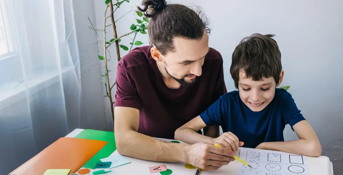 Neurodiverse boy and father learning