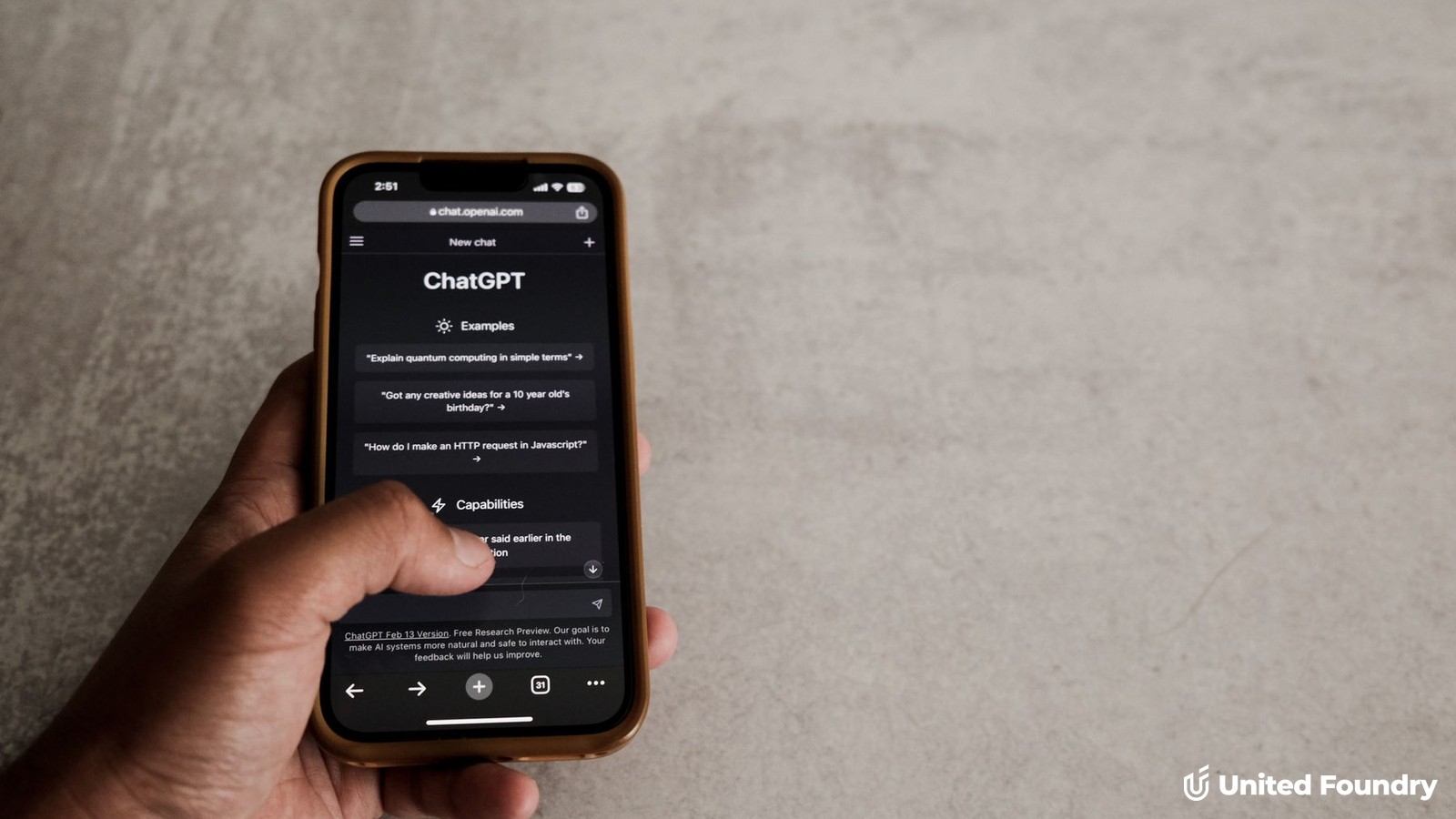 A hand holding a smartphone with the ChatGPT app open, used to search for a local contractor