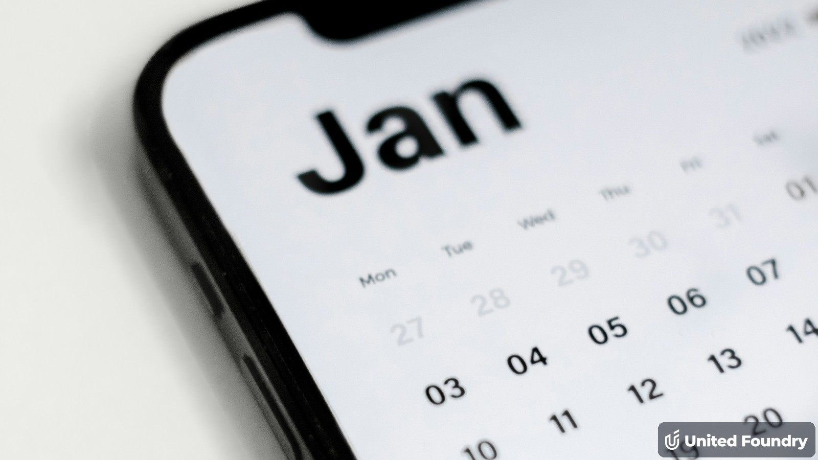 Close-up of a booking calendar on a smartphone screen, representing an online booking form for a trades website