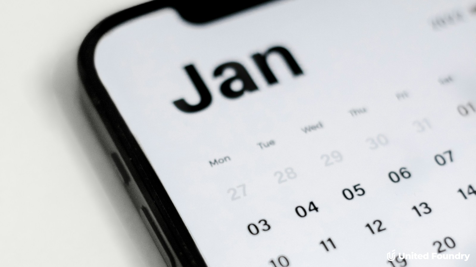Close-up of a booking calendar on a smartphone screen, representing an online booking form for a trades website