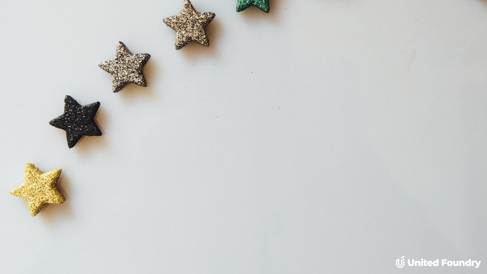 Five glitter stars arranged in a rising curve on a white background, representing an average Google review star rating for a contractor.