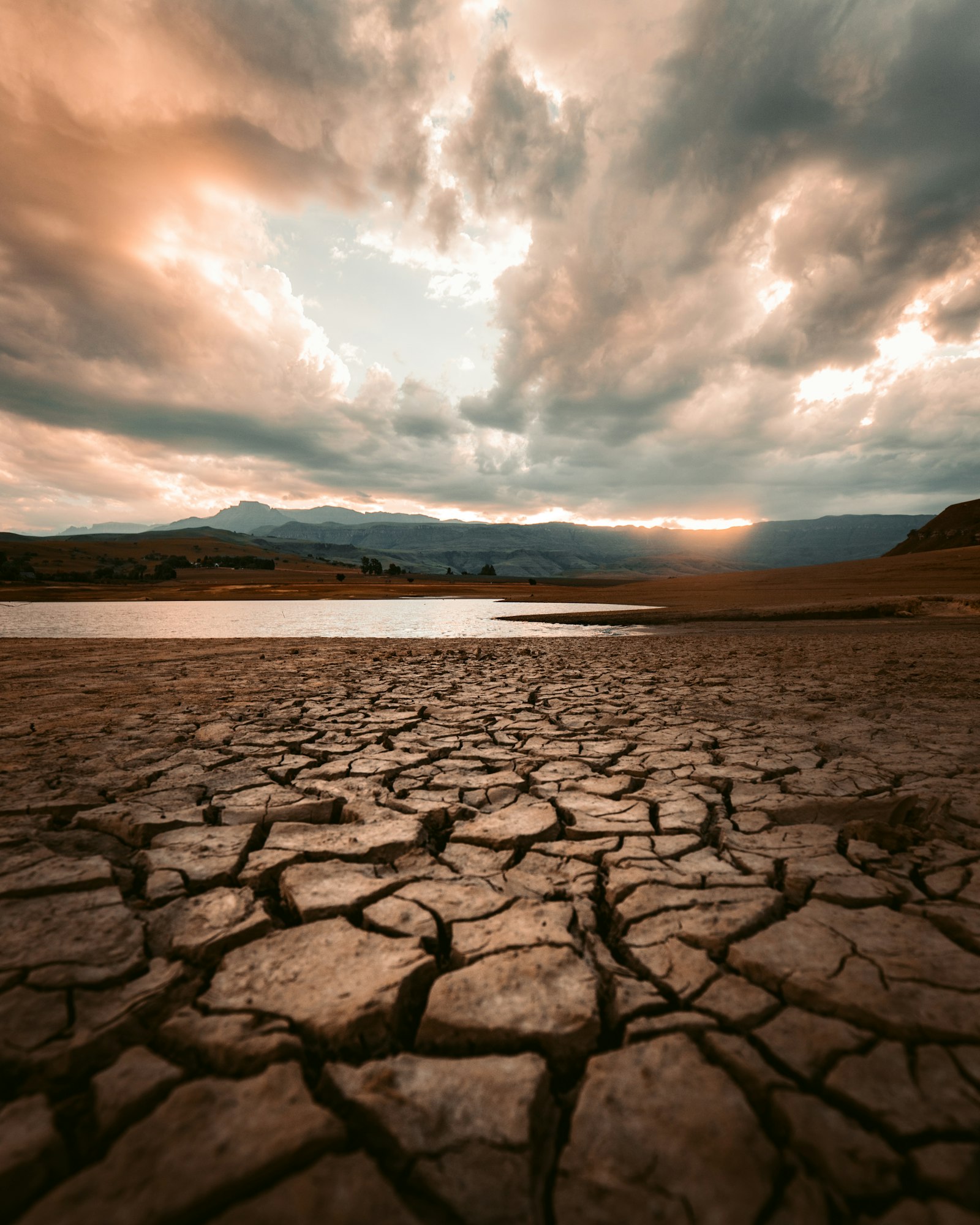 Cracked, bone-dry lakebed with receding water, symbolizing a dried-up sales pipeline