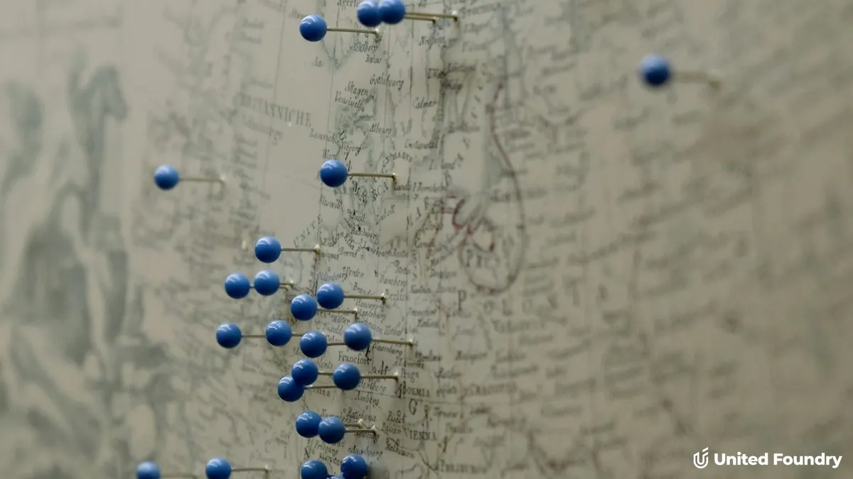 Vintage map marked with multiple blue push pins representing different service area locations, United Foundry logo