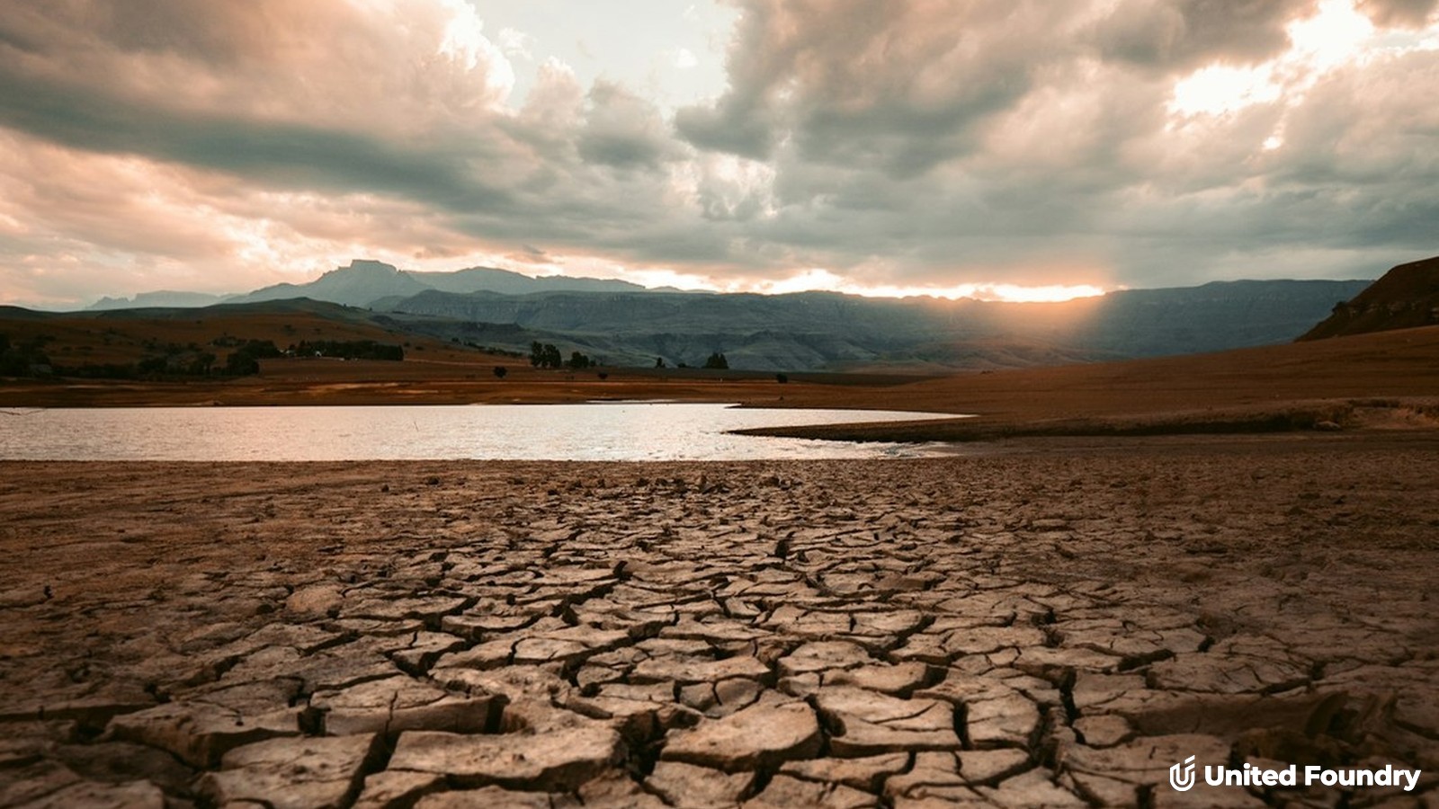 Cracked, bone-dry lakebed with receding water, symbolizing a dried-up sales pipeline